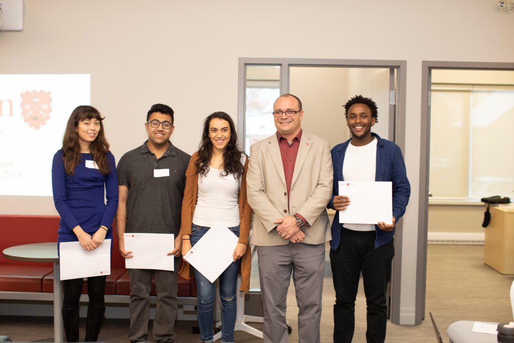 The winners of the 2018-19 Fellowship stand next to Dr. Geoff Read, Dean of Fass, smiling.