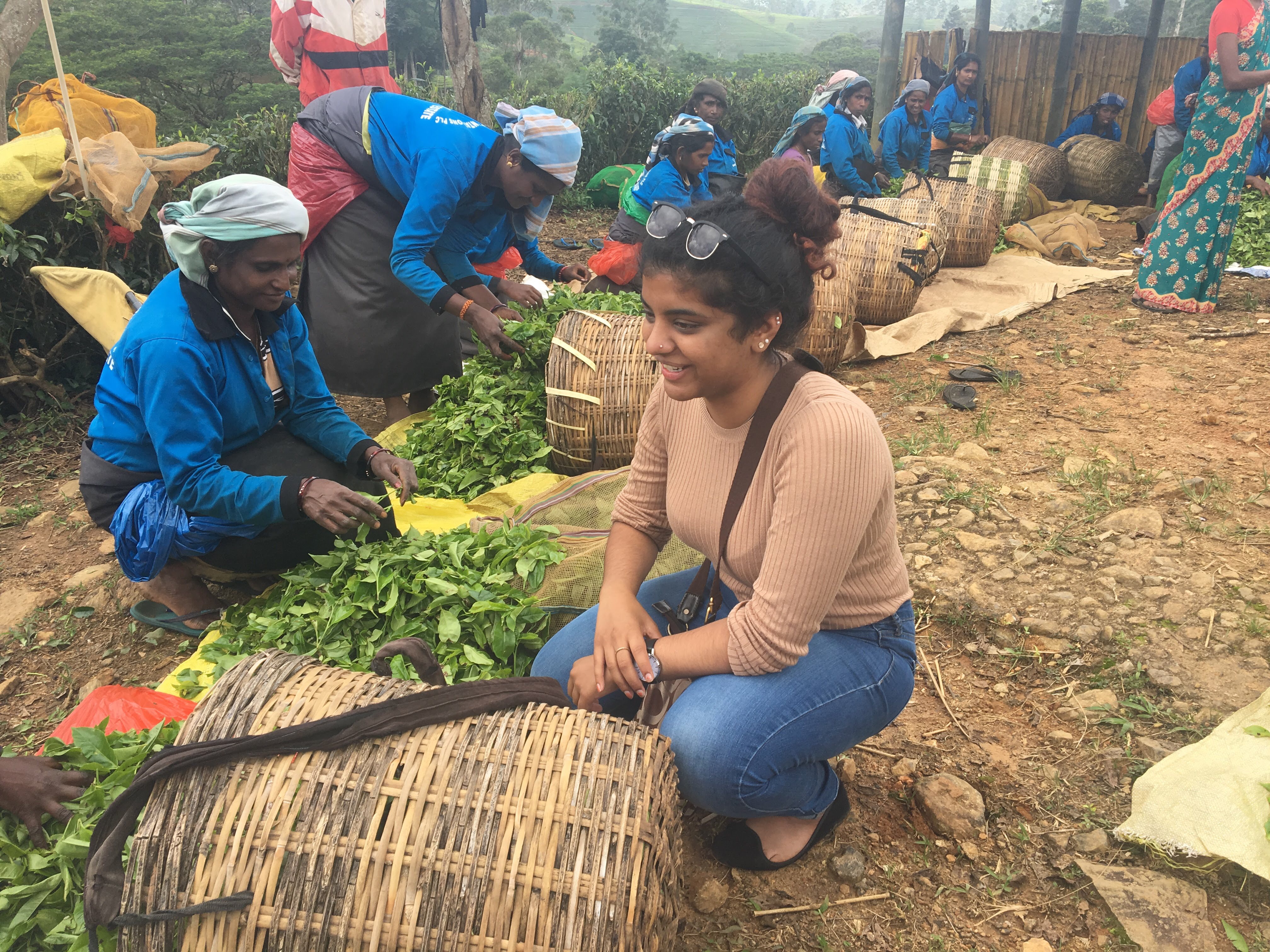 Huron student Valentina Gnanapragasam sits near Sri Lankan plantation workers. Her CURL Travel Bursary helped her volunteer there with Uniterra.