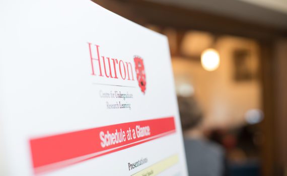 A photograph of the CURL logo on the large schedule poster displayed next to Huron's Great Hall during the 2018 CURL Spring Conference.