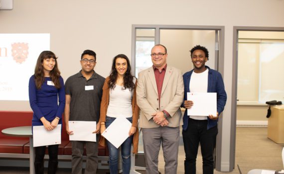 The winners of the 2018-19 Fellowship stand next to Dr. Geoff Read, Dean of Fass, smiling.