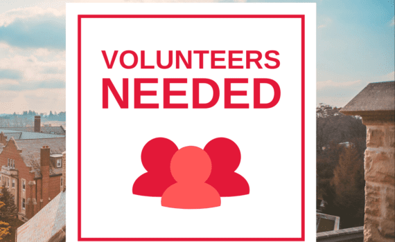 An advertisement reading "Call For Volunteers" with an icon of a group of 3 red figures. The background is a picture of the tops of Huron buildings against a bright blue sky.