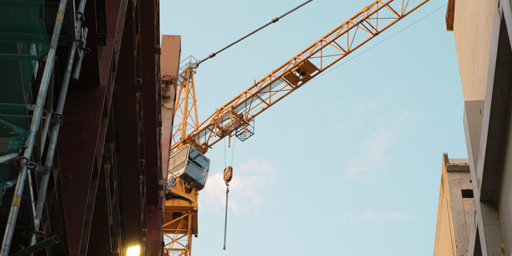 GenXGenZ Banner construction crane between two buildings
